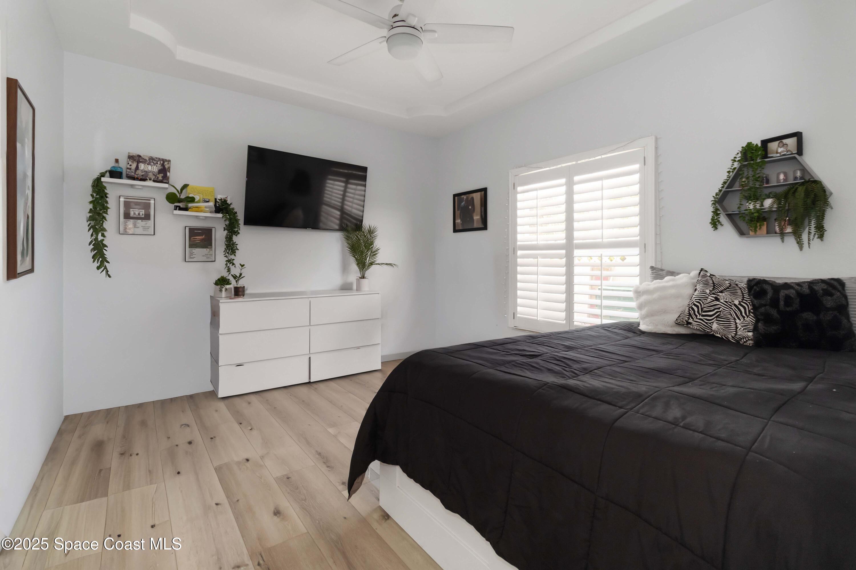 341 Buckskin Street Palm Bay, FL 32909 - Photo 44 of 69 a bedroom with a bed tv and window