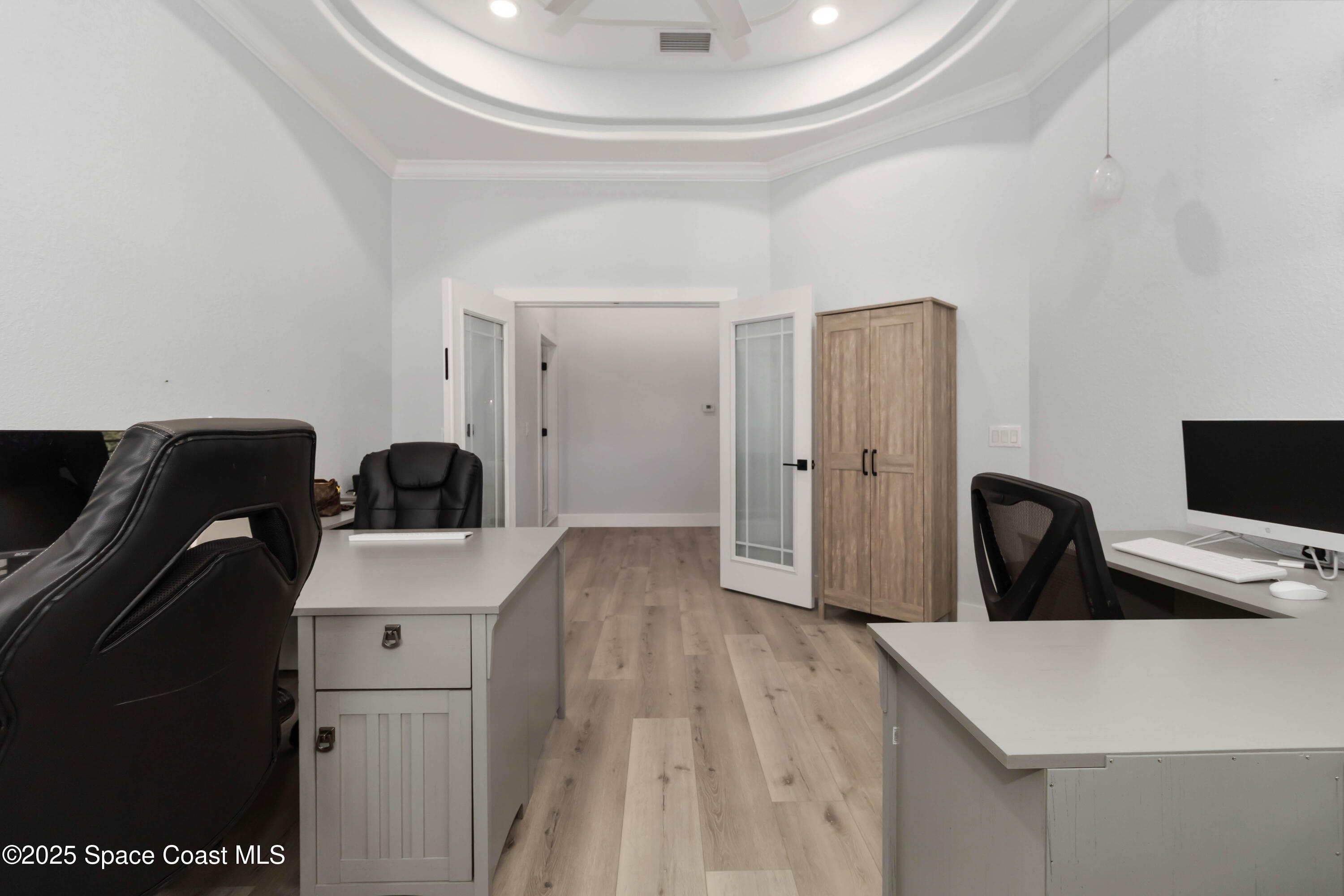 341 Buckskin Street Palm Bay, FL 32909 - Photo 45 of 69 a view of a workspace with furniture and wooden floor