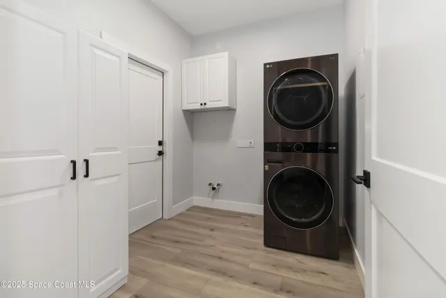 an aerial view of a residential houses with yard