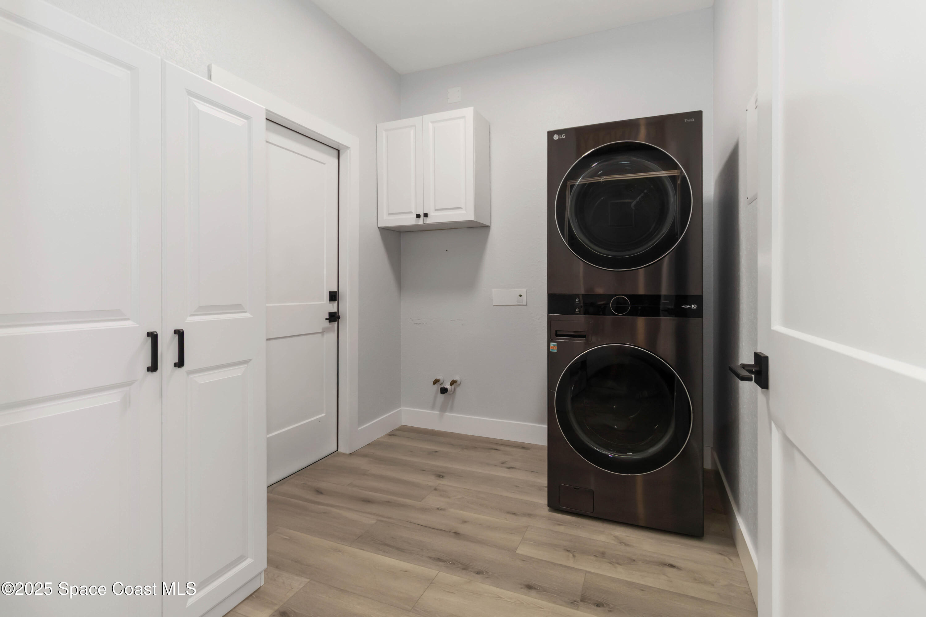341 Buckskin Street Palm Bay, FL 32909 - Photo 46 of 69 a view of a storage and utility room with washer and dryer