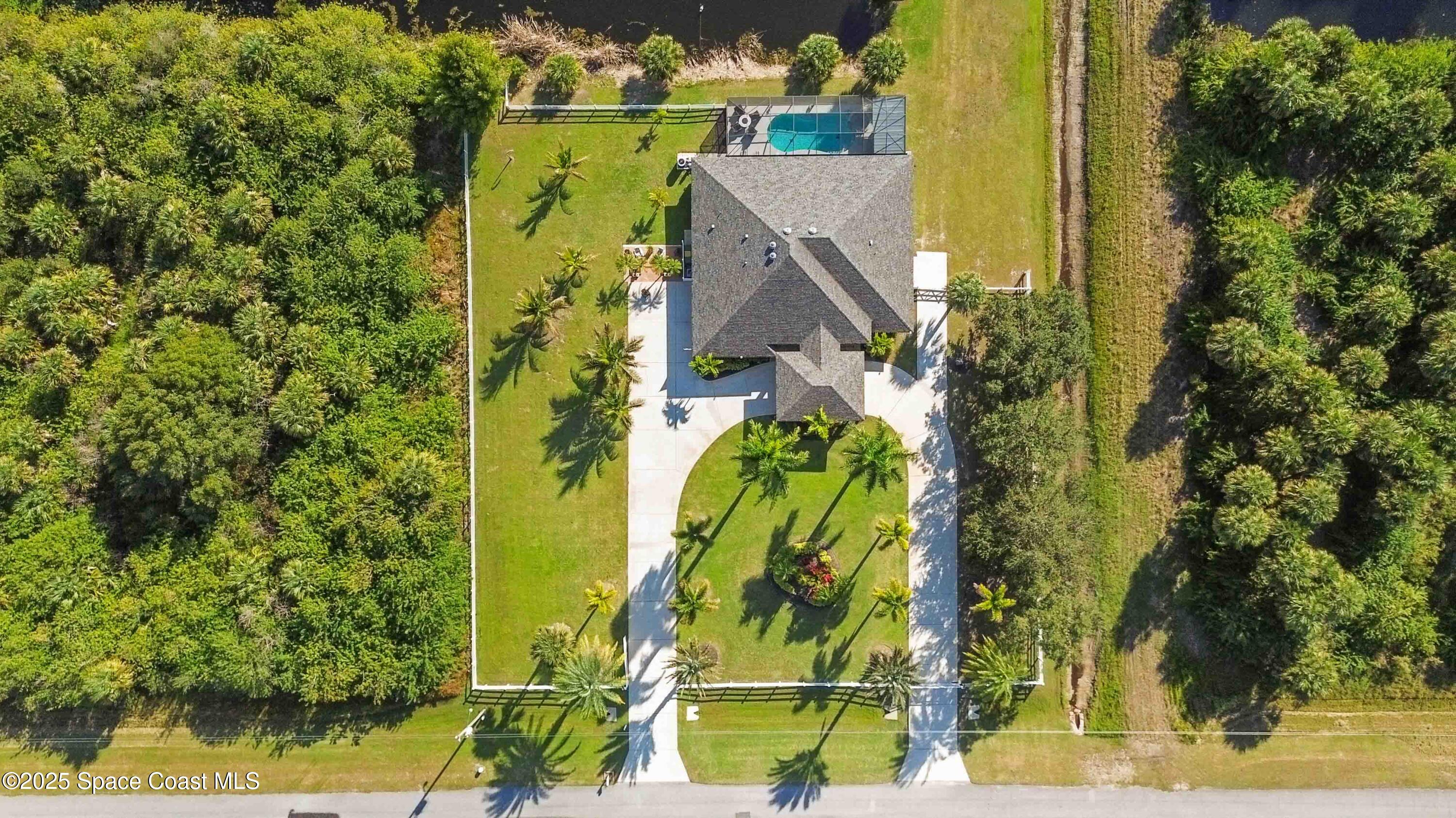 341 Buckskin Street Palm Bay, FL 32909 - Photo 59 of 69 an aerial view of a residential houses with yard
