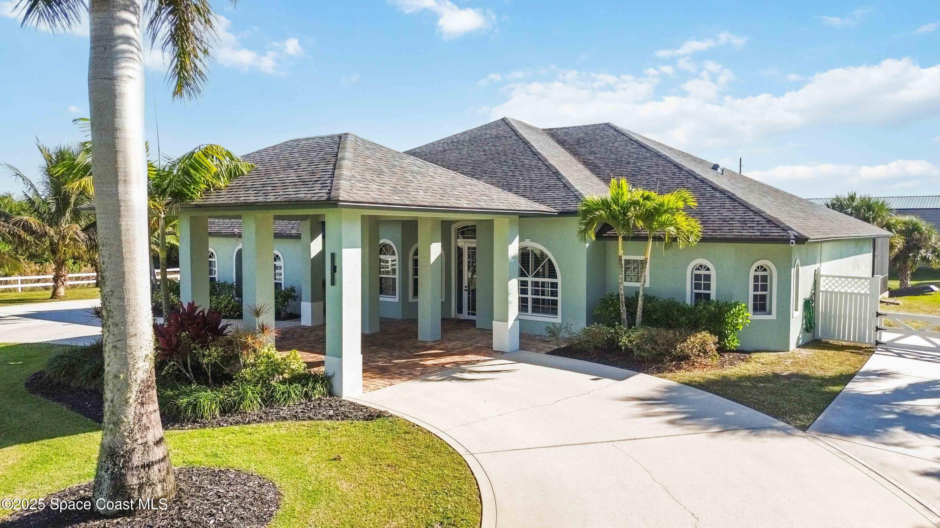 341 Buckskin Street Palm Bay, FL 32909 - Photo 6 of 69 a front view of a house with garden