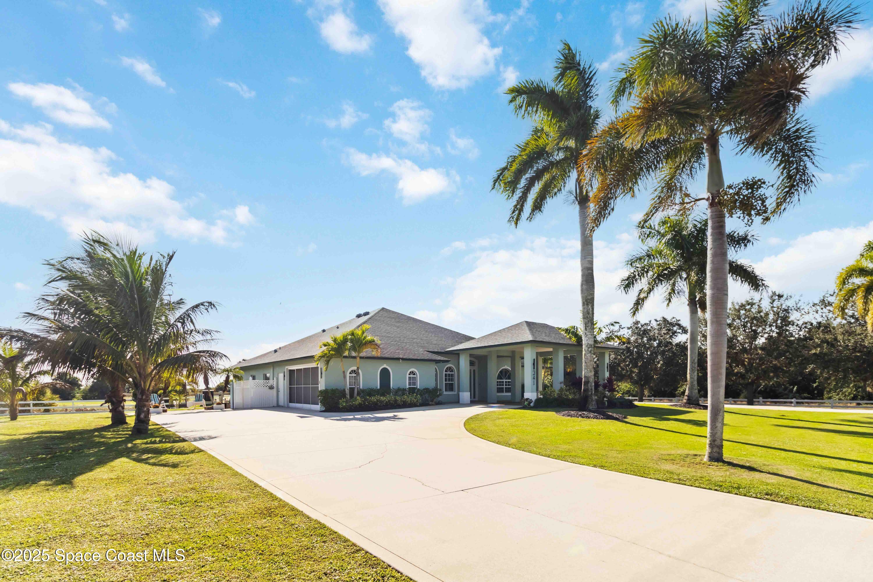 341 Buckskin Street Palm Bay, FL 32909 - Photo 7 of 69 a front view of house with yard and swimming pool
