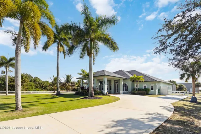 a view of a swimming pool with an outdoor seating