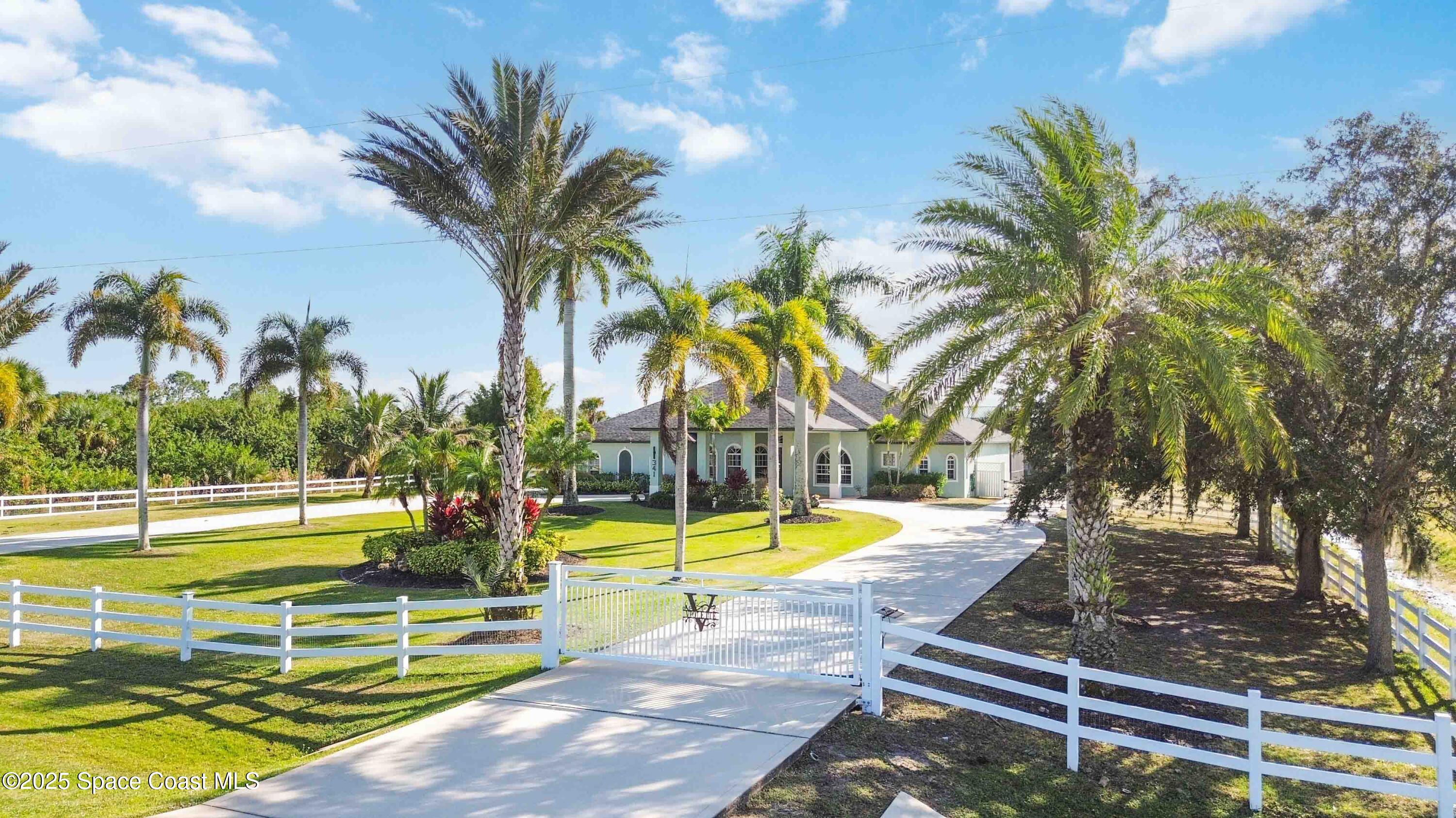 341 Buckskin Street Palm Bay, FL 32909 - Photo 9 of 69 a view of a swimming pool with an outdoor seating
