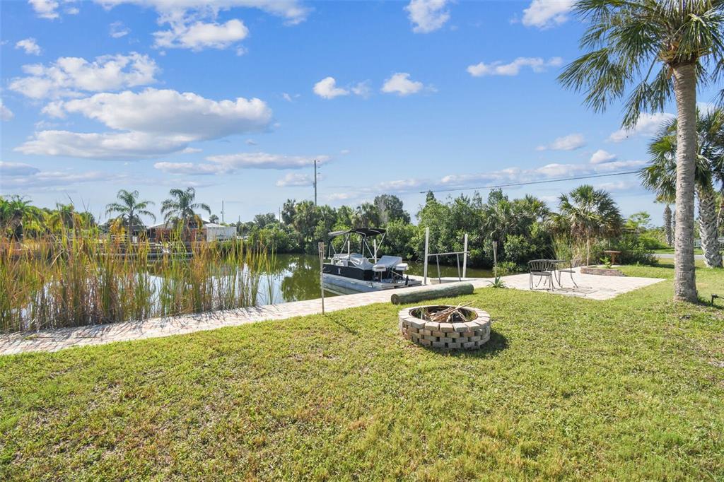 3314 Fernleaf Drive Hernando Beach, FL 34607 - Photo 19 of 33 a swimming pool with an outdoor space and seating area