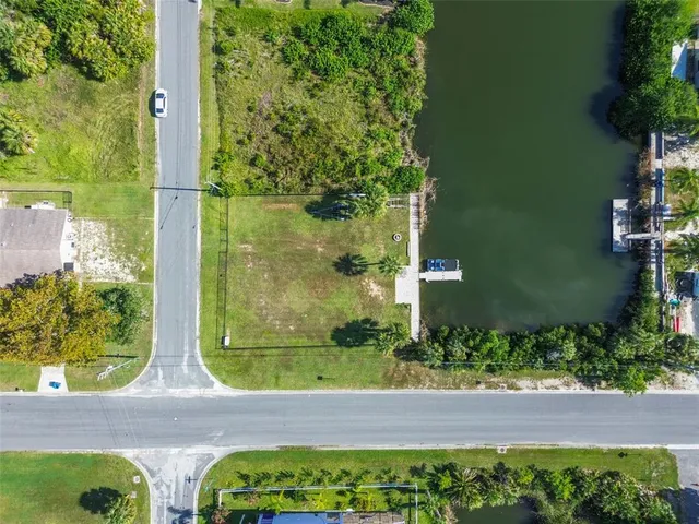 an aerial view of a houses with ocean view
