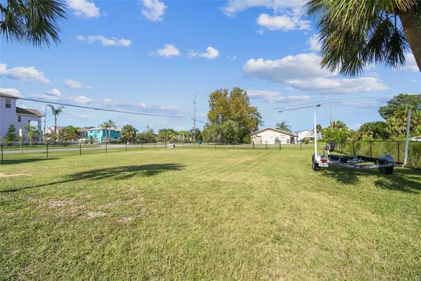 a view of a lake with houses in the back