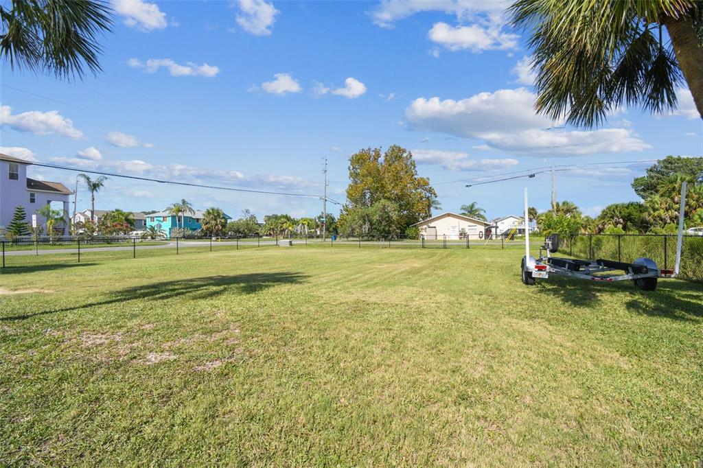 3314 Fernleaf Drive Hernando Beach, FL 34607 - Photo 30 of 33 a backyard of a house with lots of green space and lake view
