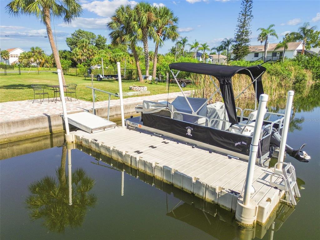 3314 Fernleaf Drive Hernando Beach, FL 34607 - Photo 3 of 33 a view of swimming pool with a garden and outdoor seating