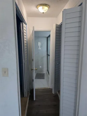 a view of a bathroom from a hallway