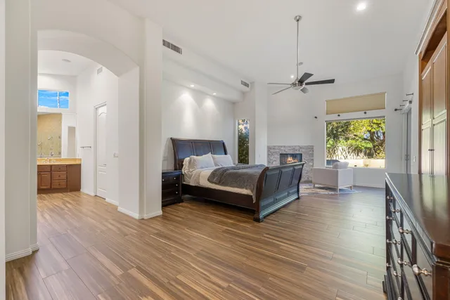 a view of a swimming pool with an outdoor seating and mountain view