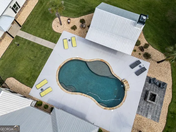 an aerial view of a house with outdoor space