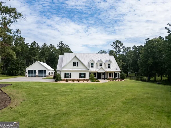 a view of a dining room with furniture wooden floor and chandelier