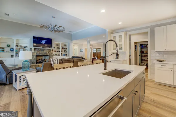 a spacious bedroom with a bed couch and a ceiling fan