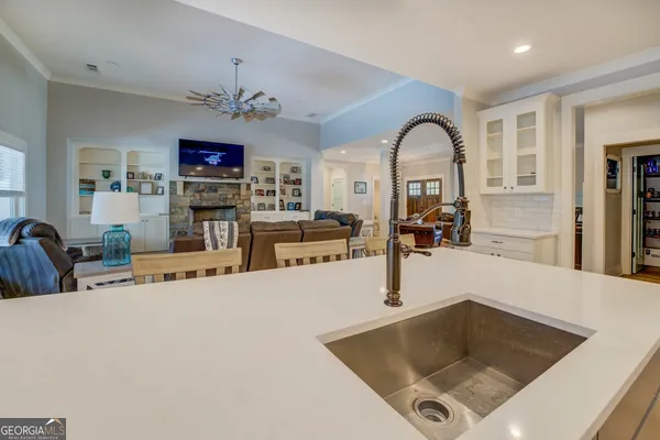 a spacious bathroom with a double vanity sink a mirror and a bathtub