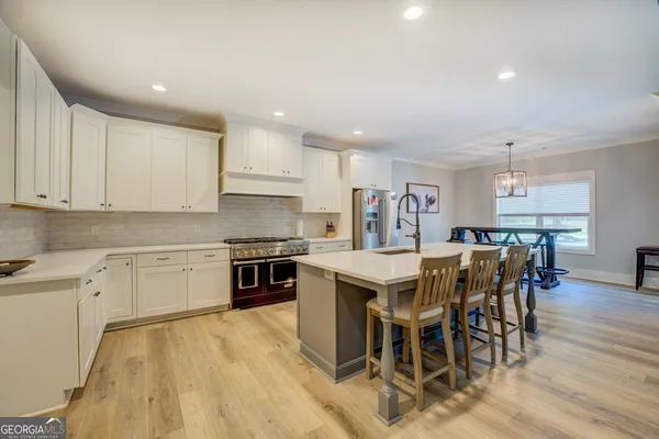 a bath tub sitting in a bathroom next to a window