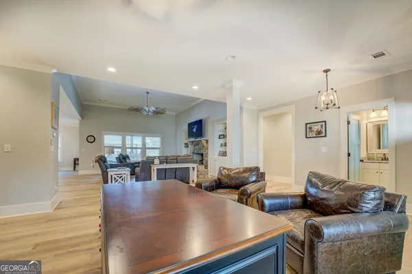 a white bath tub sitting next to a white toilet and sink