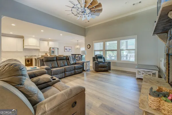 a view of a room with a ceiling fan