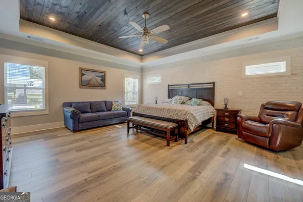 a view of swimming pool and trees in the background
