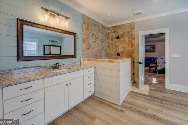 a kitchen with stainless steel appliances a sink a refrigerator and window