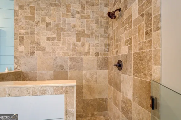 a view of a field with trees in the background