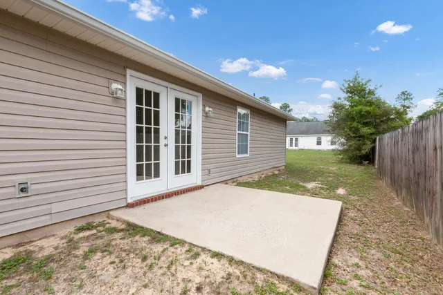 a view of a backyard of the house
