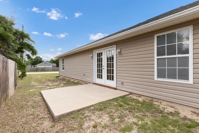 a view of a backyard with a garden and plants