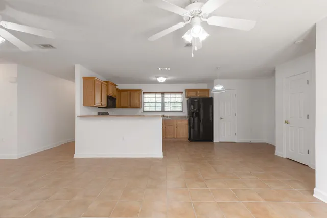 a view of a kitchen with a sink cabinets and window