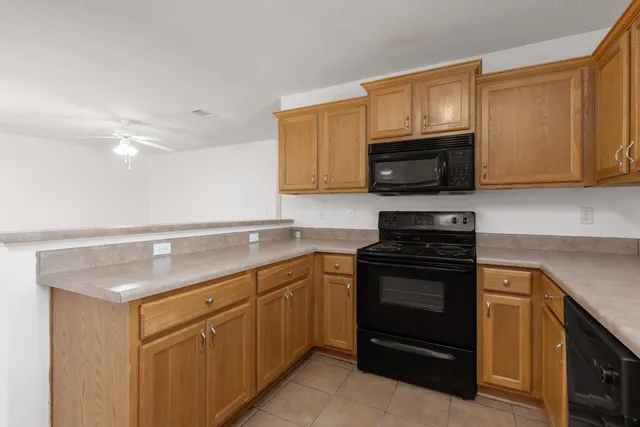 a kitchen with a sink stove and microwave