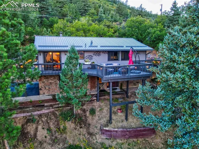 a view of a house with brick walls and a small yard