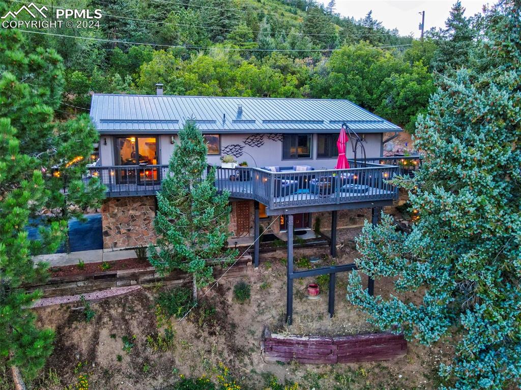 a view of a house with brick walls and a small yard