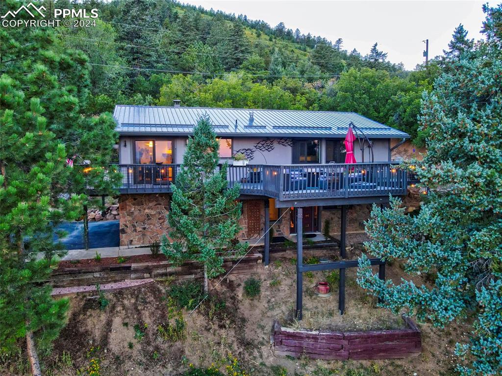 1306 Limerock Lane Colorado Springs, CO 80906 - Photo 2 of 50 a table and chairs in front of the house