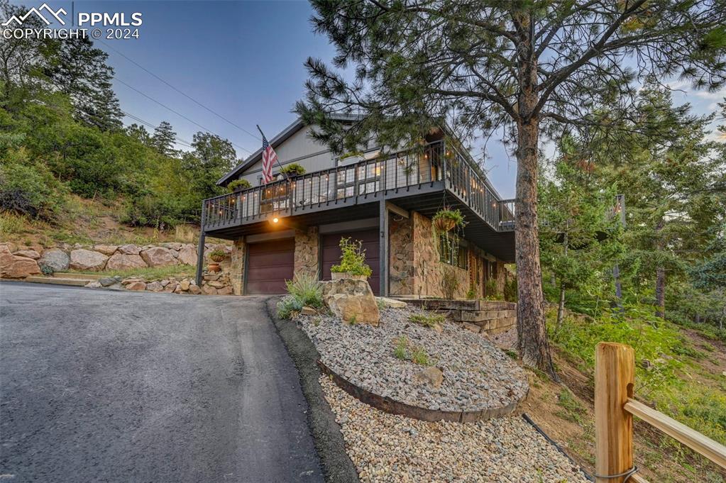 1306 Limerock Lane Colorado Springs, CO 80906 - Photo 29 of 50 a front view of a house with garden