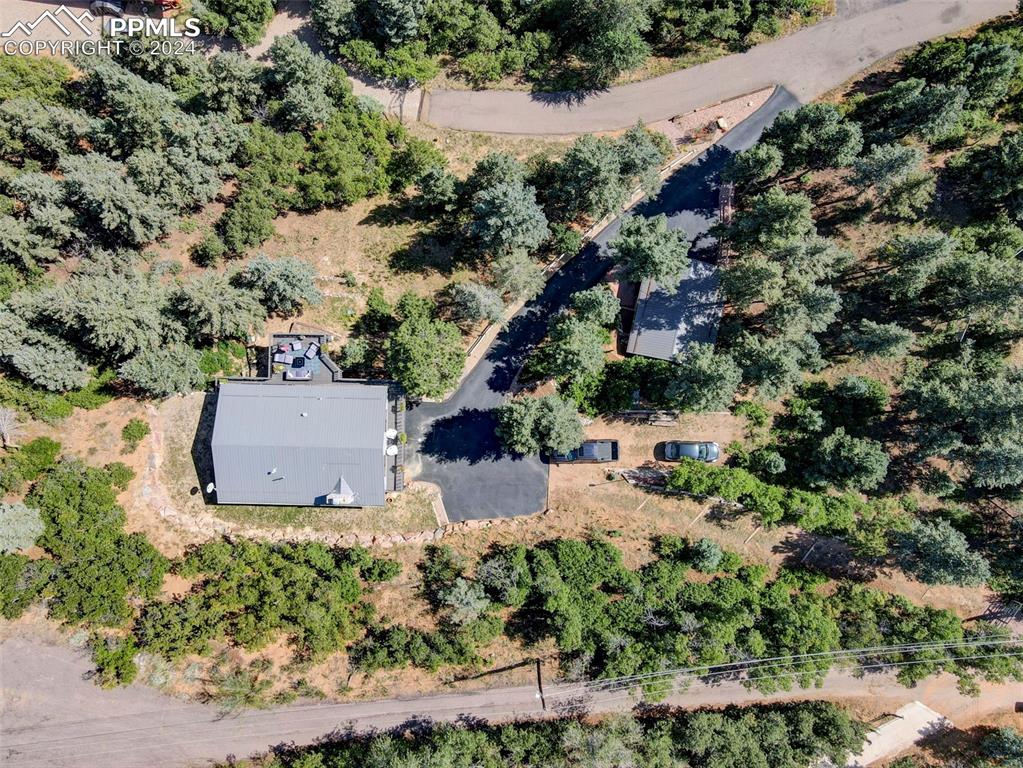 1306 Limerock Lane Colorado Springs, CO 80906 - Photo 35 of 50 an aerial view of a house with a yard and lake view