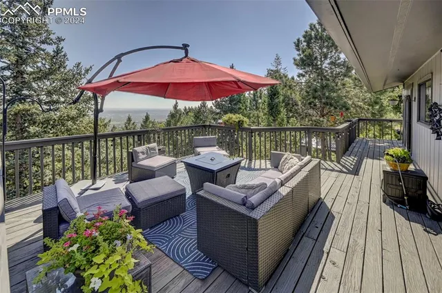 a view of a balcony with two chairs and a table
