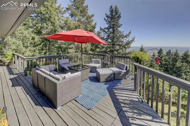 a view of a deck with furniture