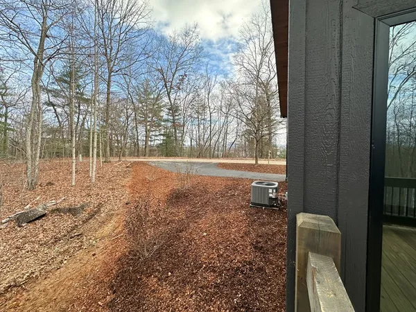 a backyard of a house with lots of green space