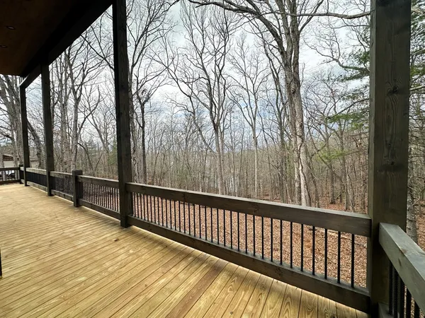 a view of a balcony with trees