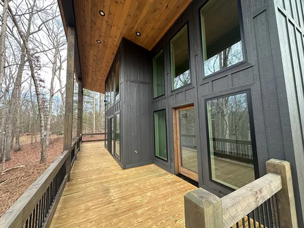 a balcony with view of outdoor space