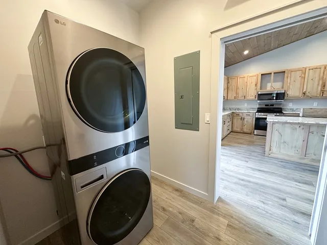 a view of a kitchen with a washer and dryer