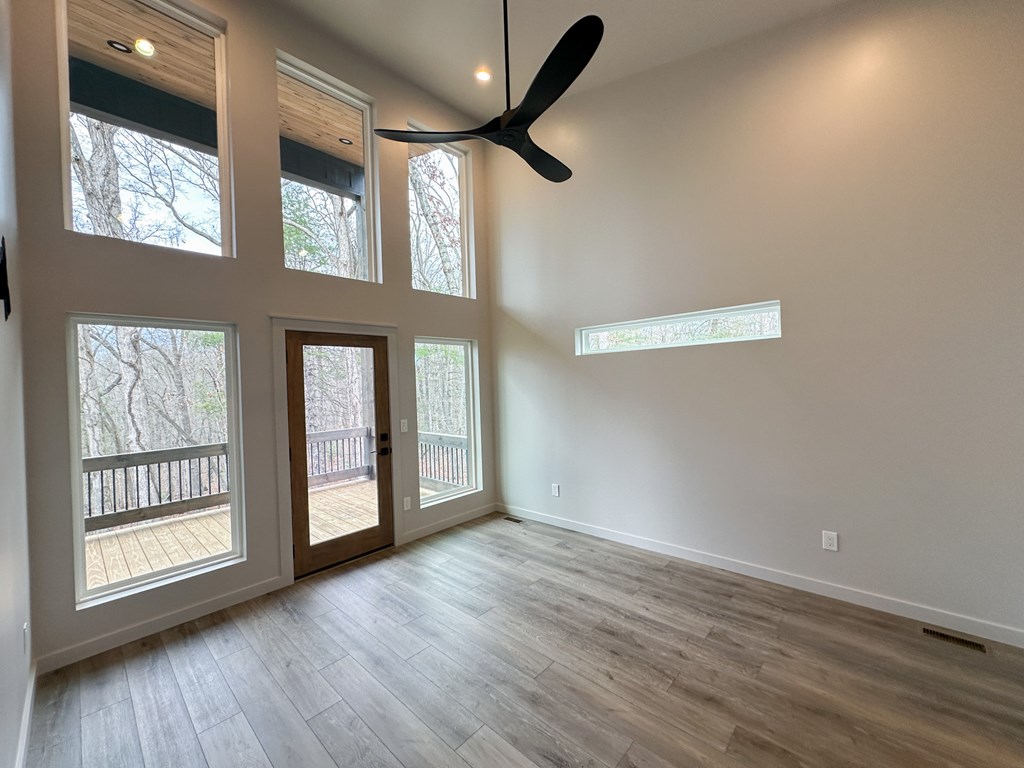 660 Old Toccoa Road Morganton, GA 30560 - Photo 38 of 45 a view of an empty room with a window and wooden floor