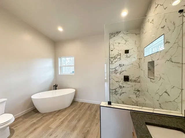 a bathroom with a toilet and a sink