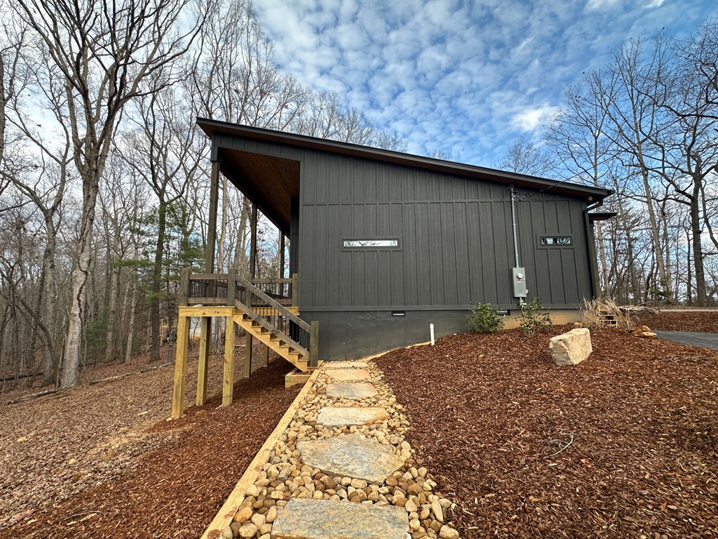 660 Old Toccoa Road Morganton, GA 30560 - Photo 8 of 45 a backyard of a house with table and chairs