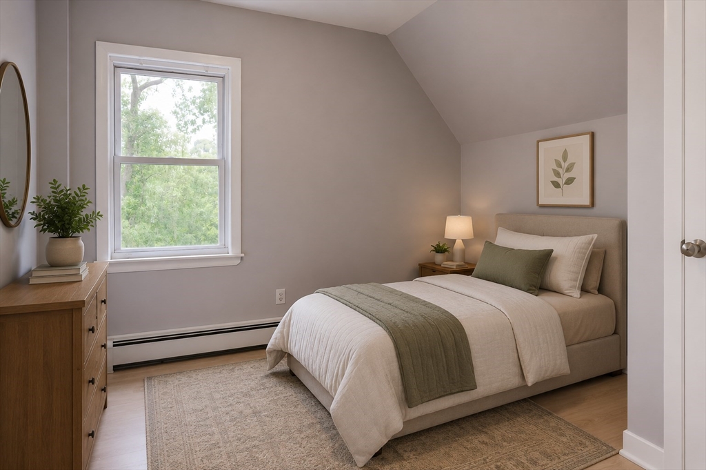32 Dale Street Franklin, MA 02038 - Photo 7 of 11 a bedroom with a bed and a window