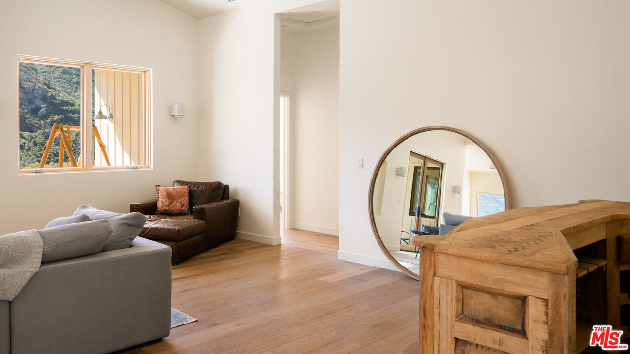26255 Piuma Road Calabasas, CA 91302 - Photo 11 of 24 a living room with furniture and a window