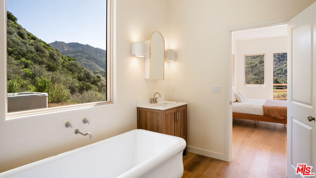 26255 Piuma Road Calabasas, CA 91302 - Photo 16 of 24 a bathroom with a bathtub and a sink