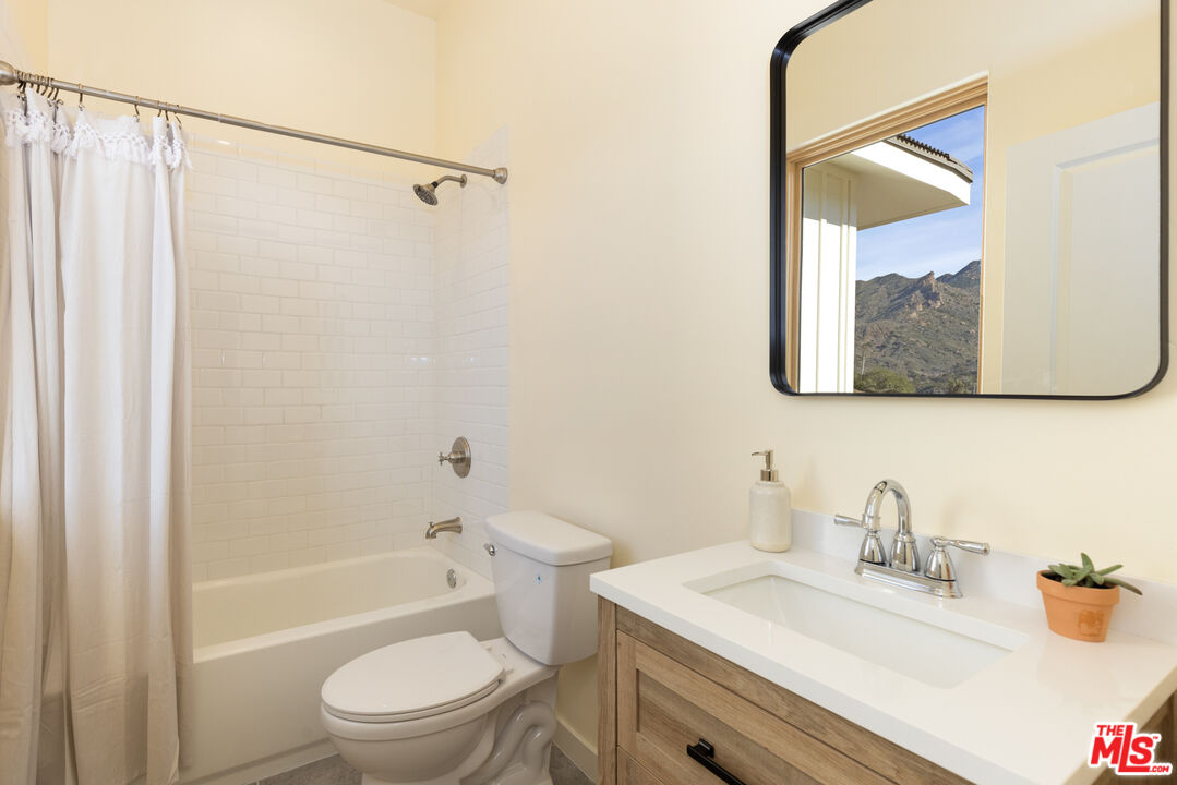26255 Piuma Road Calabasas, CA 91302 - Photo 21 of 24 a bathroom with a sink a toilet and shower