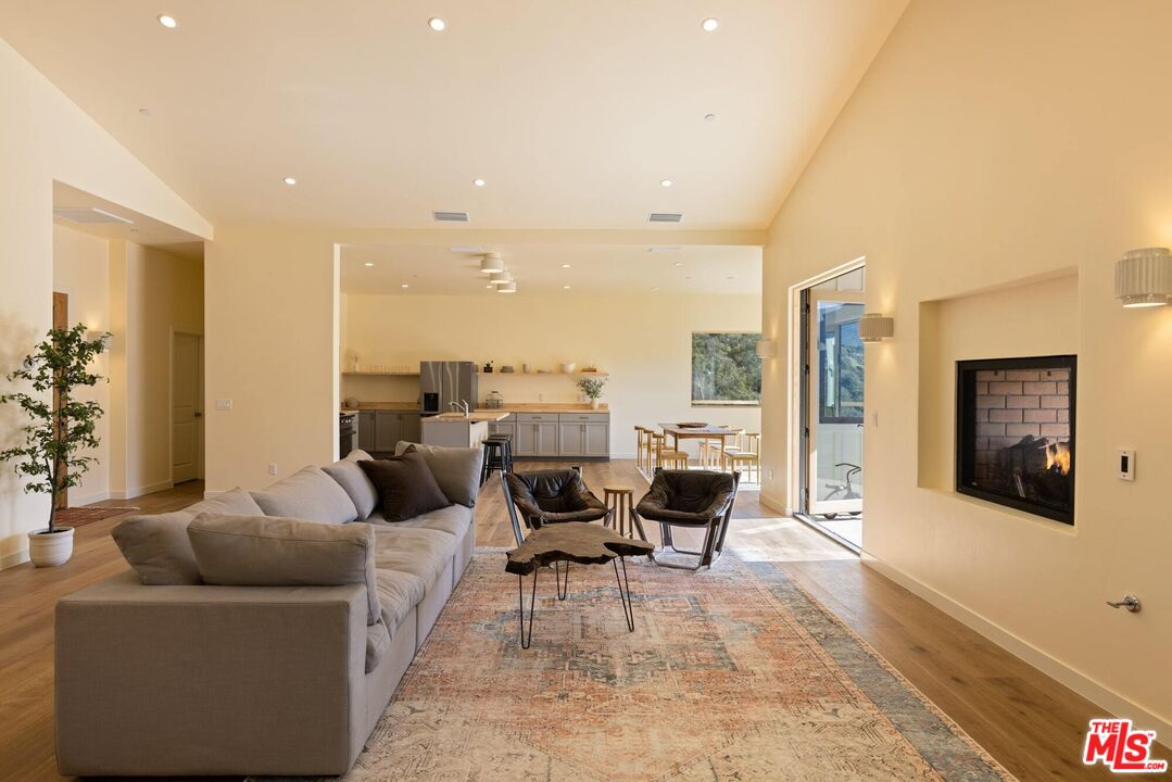 26255 Piuma Road Calabasas, CA 91302 - Photo 7 of 24 a living room with furniture and a large window