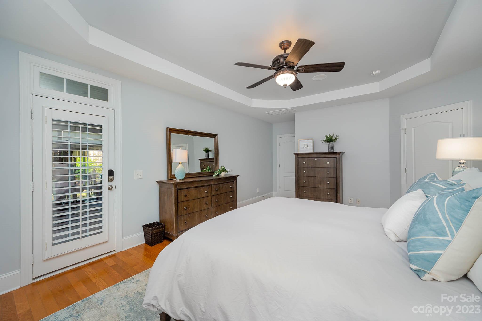 4922 Spur Ranch Road Charlotte, NC 28277 - Photo 12 of 33 a bedroom with a bed and dresser with mirror